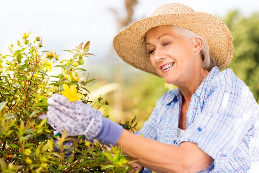 Woman focusing on a plant